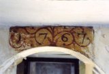 The date of construction ( or reconstruction) "1767" painted above a door (photo taken in 1989.
