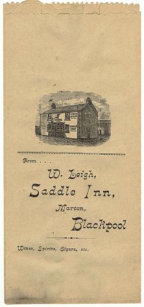 A paper bag used for spirits sold at The Saddle to drink off the premises c1900. William Leigh was landlord of the Saddle Inn from 1892. The building was extended in 1924. His wife, Elizabeth, was still there in 1942.