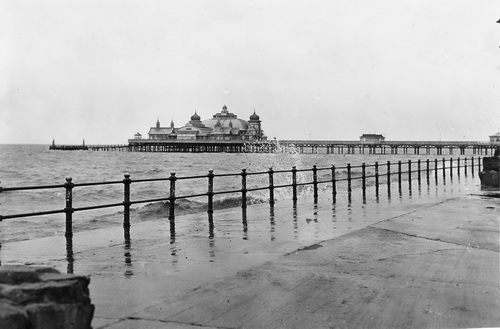 Photograph of a high tide with the waves lapping the Outer Promenade, St.Annes-on-the-Sea in February 1956.