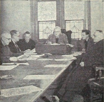 The Baths Committee meeting at Blackpool Town Hall, mid-February, 1947. There was no heating so members had to keep their overcoats on and get on with the business. Pictured are Ald. J.R.Quayle,J.P., Coun.F.R.Boydell, Mr.J.H.Hollingworth, Coun.W.Ogden, MrJ.Bell and Coun.A.Dyson.