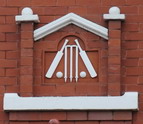 Cricket bats, balls and wickets in terra cotta which were probably placed within the pediment above the doorway to Alderlea. This feature was removed and is now at the house in Woodland Grove.